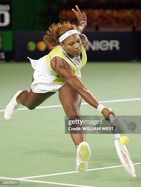 Serena Williams of the US reaches for a return against compatriot Lindsay Davenport in the women's singles final at the 2005 Australian Open tennis...