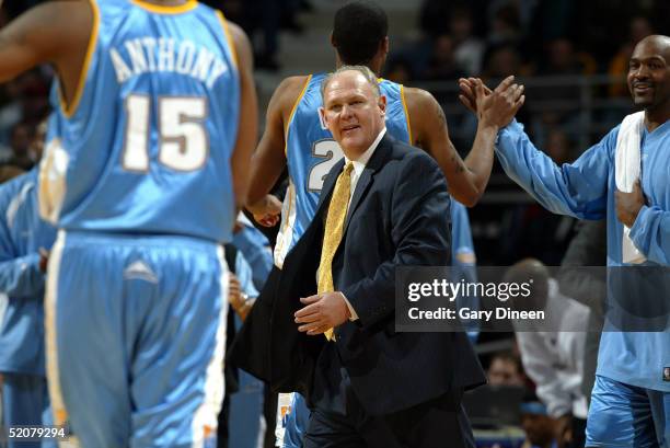 Head coach George Karl of the Denver Nuggets reacts to his team as Carmelo Anthony returns to the bench during a game against the Milwaukee Bucks at...