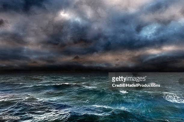 dangerous storm over ocean - ruffled stock pictures, royalty-free photos & images