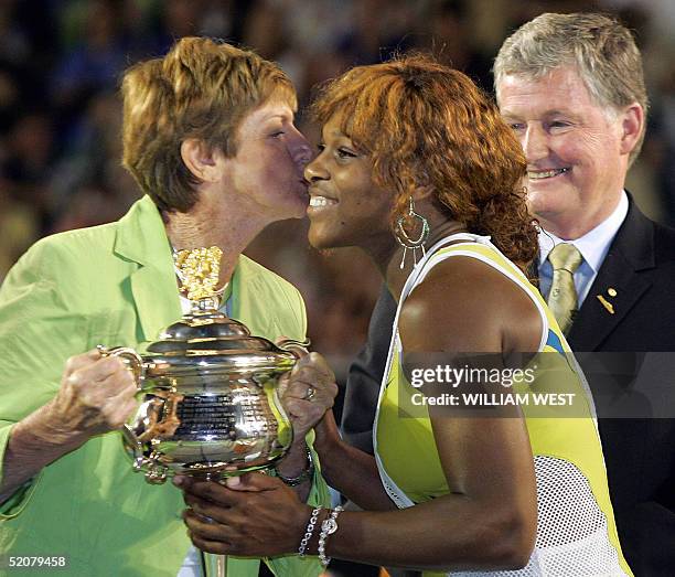 Eleven-time Australian Open champion Margaret Court presents the 2005 trophy to winner Serena Williams of the US following her victory over...