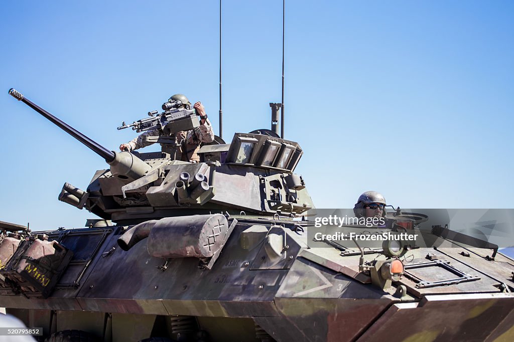 United States Marines military tank with soldiers on board