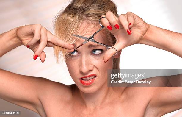 girl cutting own hair - bad bangs stock pictures, royalty-free photos & images