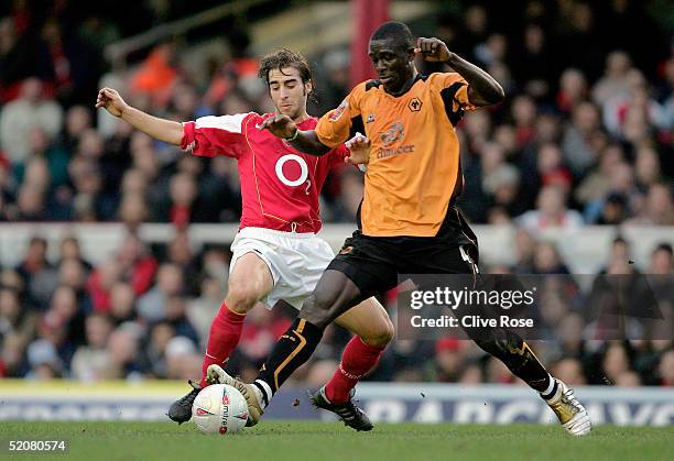 Mathieu?Flamini of Arsenal and Seyi George?Olofinjana of Wolverhampton Wanderers batlle for the ball during the FA Cup Fourth Round match between...