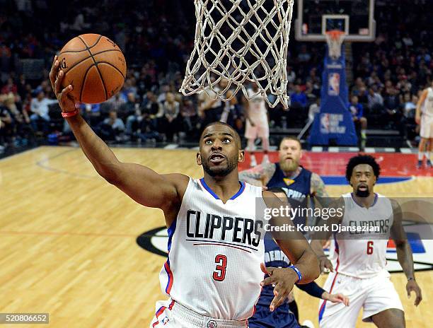 Chris Paul of the Los Angeles Clippers scores a basket against the Memphis Grizzlies during the first half of the basketball game at Staples Center...