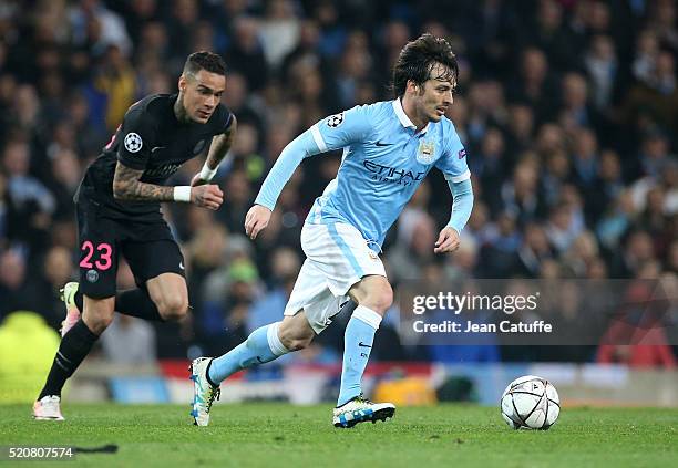 David Silva of Manchester City and Gregory Van Der Wiel of PSG in action during the UEFA Champions League quarter final second leg match between...