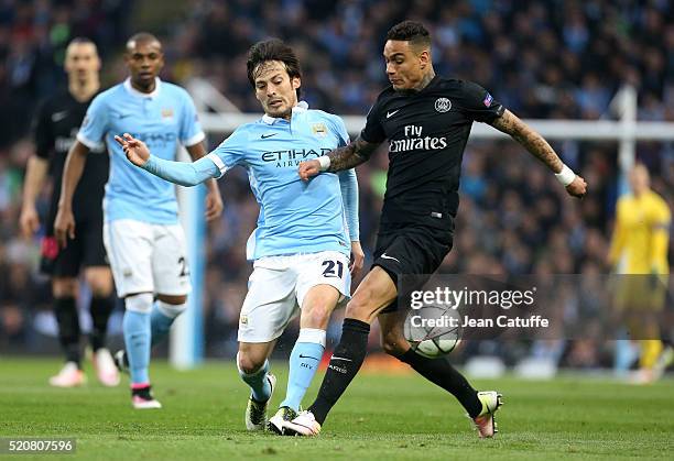 David Silva of Manchester City and Gregory Van Der Wiel of PSG in action during the UEFA Champions League quarter final second leg match between...