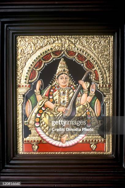 painting of goddess saraswati playing veena, tanjore thanjavur in tamil nadu, india - saraswati stock-fotos und bilder