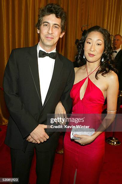 Director Alexander Payne and actress/wife Sandra Oh arrive at the 57th Annual DGA Awards Dinner at the Beverly Hilton Hotel on January 29, 2005 in...