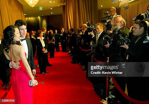 Director Alexander Payne and actress/wife Sandra Oh arrive at the 57th Annual DGA Awards Dinner at the Beverly Hilton Hotel on January 29, 2005 in...