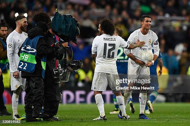 Cristiano Ronaldo of Real Madrid hides the match ball after scoring a hat trick during the UEFA Champions League quarter final second leg match...