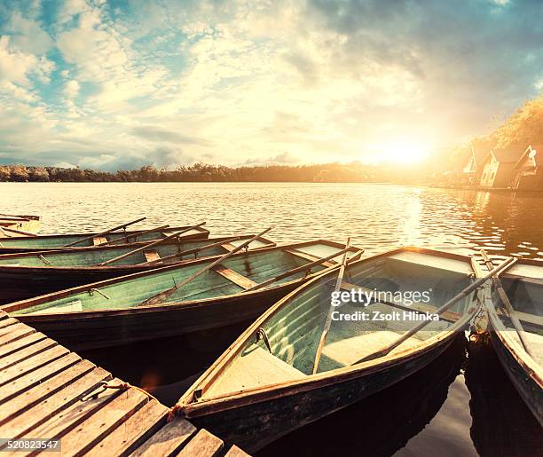 boat on water - tata hungary stock pictures, royalty-free photos & images