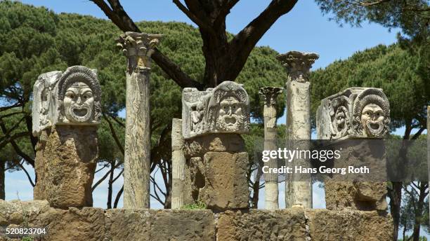 ostia antica, colonnade in front of the temple of ceres - kolonnade stock-fotos und bilder