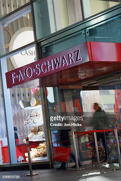 the f.a.o. schwarz flagship store on 5th avenue during the holidays, new york city - flagship stock pictures, royalty-free photos & images