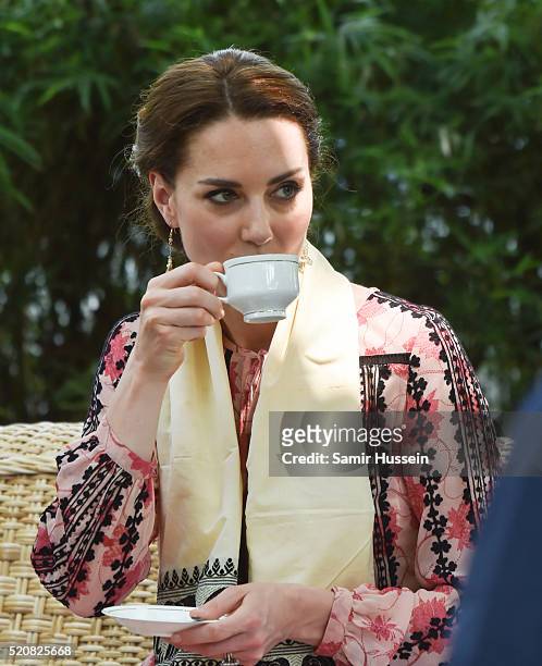 Catherine, Duchess of Cambridge drinks a cup of tea as she visits the Centre for Wildlife Rehabilitation and Conservation at Kaziranga National Park...
