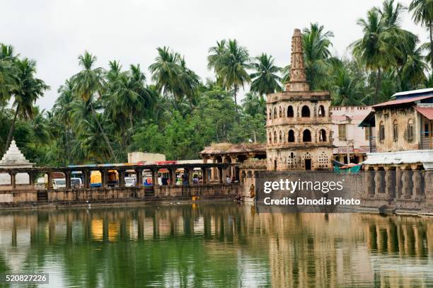 tank harida tirtha with goddess temple and victory tower, banashankari, bagalkot, karnataka, india - reservoir stock pictures, royalty-free photos & images