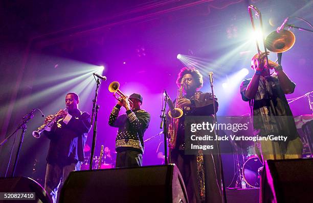 American Jazz musician Kamasi Washington plays tenor saxophone as he leads his band during a NYC Winter JazzFest concert at Webster Hall's Grand...