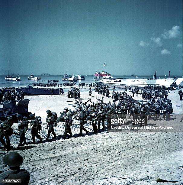 Canadian soldiers being deployed on Juno Beach, Normandy. This image was taken after the initial D-Day landings. Dated in 1944.