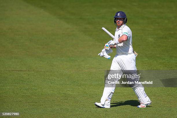 Ian Bell of Warwickshire walks off the field after he is caught out by James Vince of Hampshire for 174 during day four of the Specsavers County...