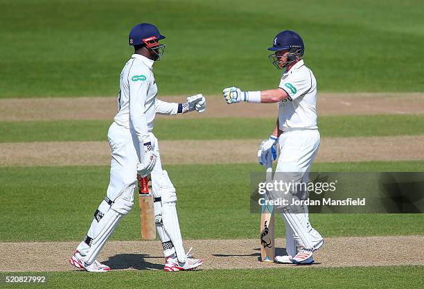 Ian Bell of Warwickshire celebrates with Keith Barker of Warwickshire during day four of the Specsavers County Championship Division One match...