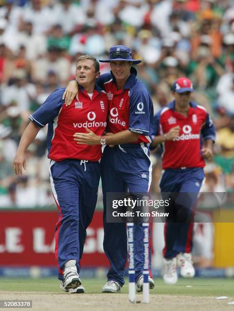 Darren Gough of England is congratulated by Michael Vaughan after taking the wicket of Nicky Boje of South Africa during the 1st One Day...