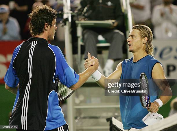 Marat Safin of Russia is congratulated by Lleyton Hewitt of Australia after winning the Men's Final during day fourteen of the Australian Open Grand...