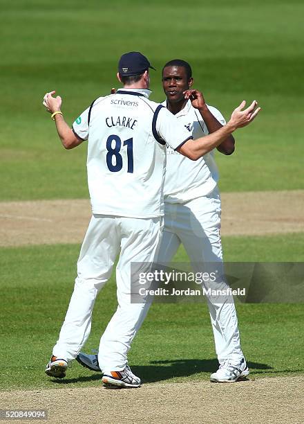 Keith Barker celebrates with Rikki Clarke of Warwickshire after getting the wicket of Michael Carberry of Hampshire during day four of the Specsavers...