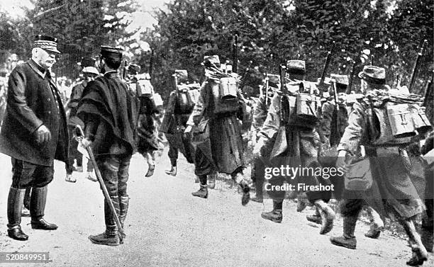 World War I 1914 1918. The French counterattack. From Paris to Marne. The General Joffre speaks with a young officer while a column of infantry with...