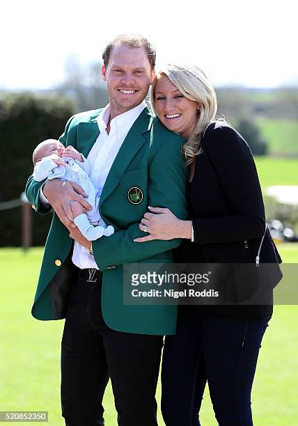 Masters champion Danny Willett poses for photographs wearing the famous green jacket with wife Nicole and son Zachariah at Lindrick Golf Club on...