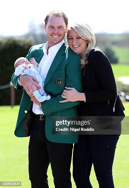 Masters champion Danny Willett poses for photographs wearing the famous green jacket with wife Nicole and son Zachariah at Lindrick Golf Club on...