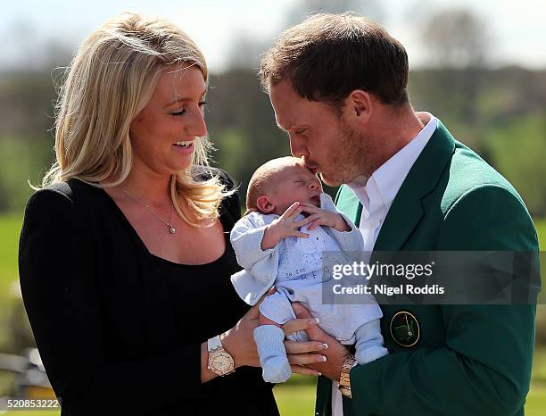 Masters champion Danny Willett poses for photographs wearing the famous green jacket with wife Nicole and son Zachariah at Lindrick Golf Club on...