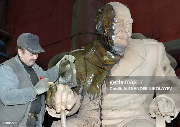 Worker prepares a statue of British Prime Minister Winston Churchill created by President of the Russian Academy of Arts, Zurab Tsereteli as a part...