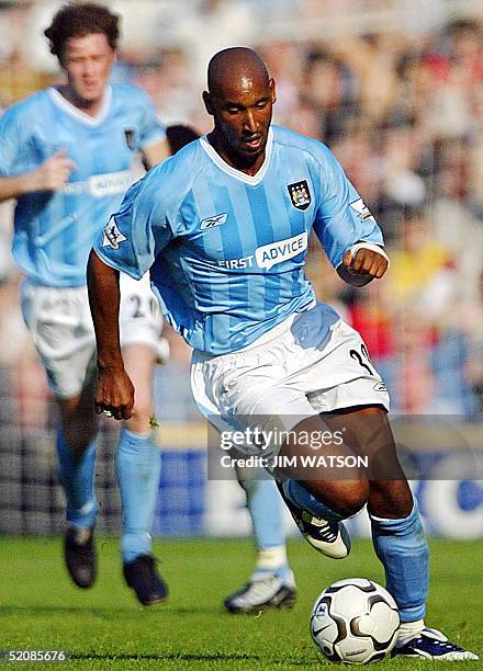 Photo taken 20 September 2003 at Fulham Football Club's stadium in London of Manchester City's shows Frenchman Nicolas Anelka taking the ball down...