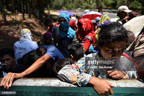 Farmers in Kidapawan city onboard a truck to head back to their village in far flung Arakan Valle on April 7, 2016 in Cotabato, Mindanao,...
