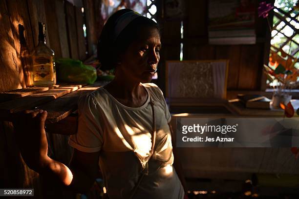 Carmelita Gallego stands in fron of the coffin of Darwin Sulang on April 11, 2016 in Cotabato, Mindanao, Philippines. Darwin died trying to get rice...