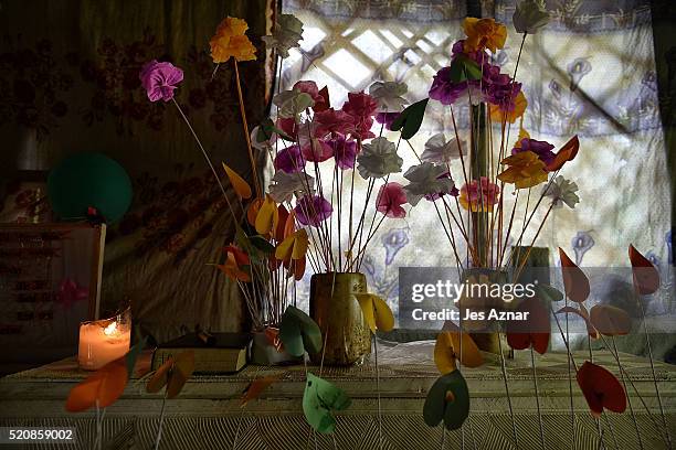 Handmade paper flowers serves as decoration during the wake of Darwin Sulang a farmer who died trying to get rice for the family on April 8, 2016 in...