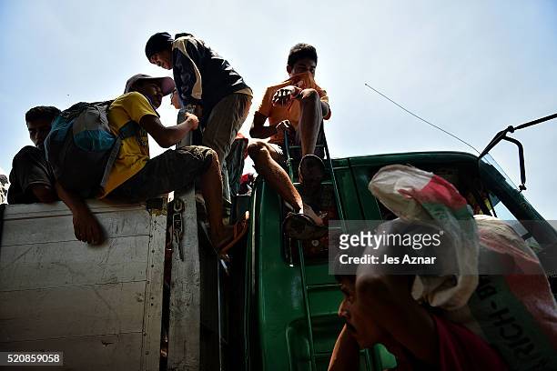 Farmers in Kidapawan city onboard a truck to head back to their village in far flung Arakan Valley on April 7, 2016 in Cotabato, Mindanao,...