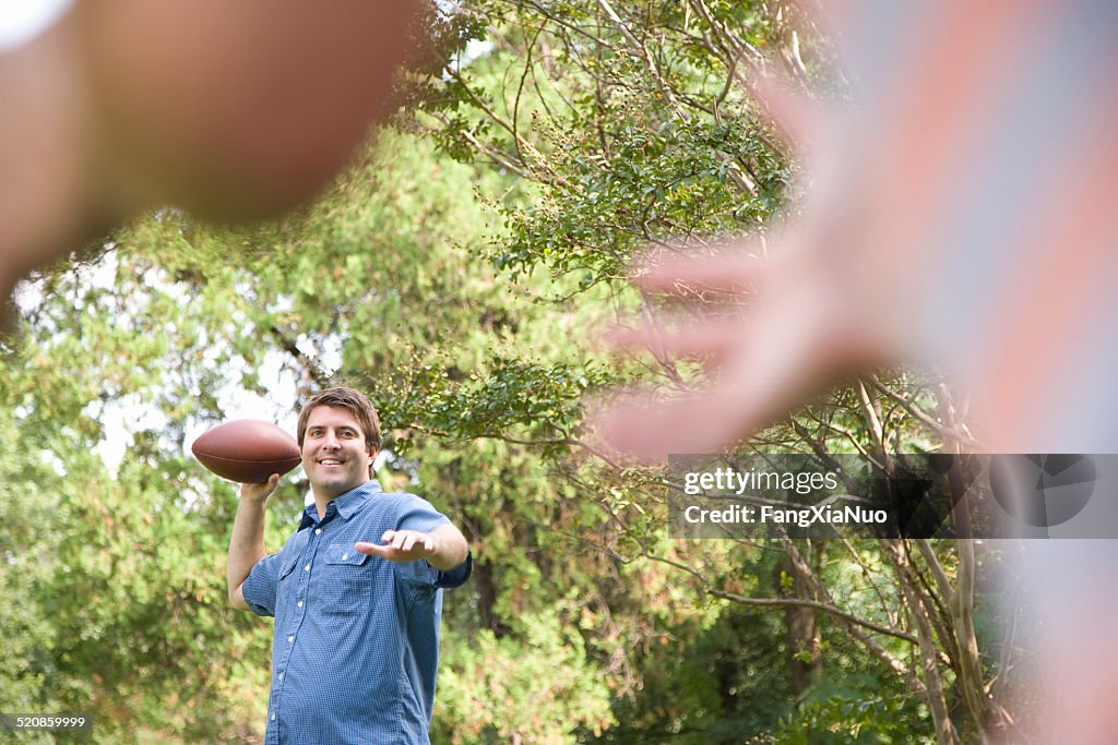 Man Tossing Football