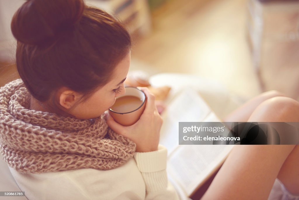 Young brunette woman in home interior.