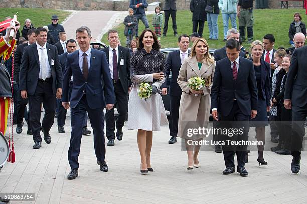 Danish Crown Prince Frederik and Crown Crown Princess Mary of Denmark greet Mexican President Enrique Pena Nieto and his wife Angelica Rivera during...