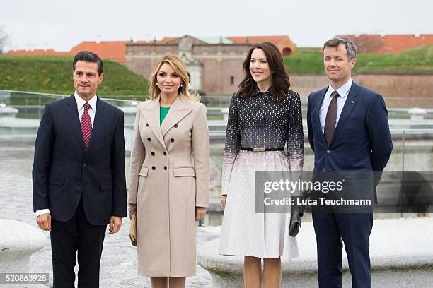 Danish Crown Prince Frederik and Crown Crown Princess Mary of Denmark greet Mexican President Enrique Pena Nieto and his wife Angelica Rivera during...