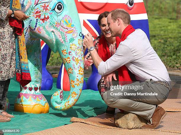 Prince William, Duke of Cambridge and Catherine, Duchess of Cambridge paint an Elephant Parade statue as they visit to the Mark Shand Foundation in...