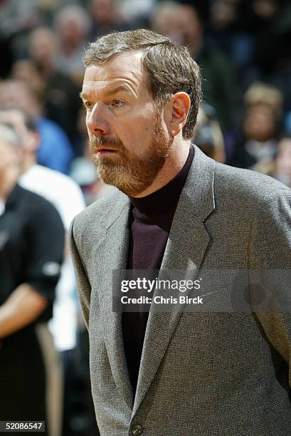 Assistant Coach P.J. Carlesimo of the San Antonio Spurs observes the national anthem during the game with the Washington Wizards on January 17, 2005...