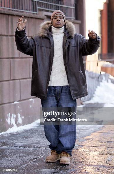 R & B singer Mario looks on from the street during filming of a music ...