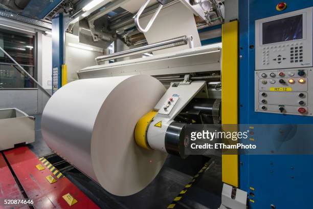 newspaper production at tamedia zurich printing plant - rolled newspaper stock pictures, royalty-free photos & images
