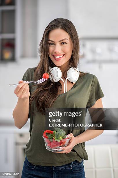 young woman in the kitchen - extreme dieting stock pictures, royalty-free photos & images