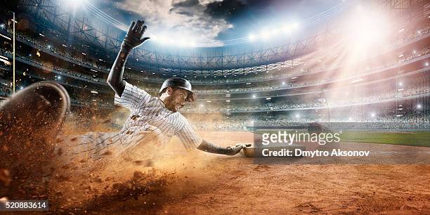 sliding on third base - base run stock pictures, royalty-free photos & images