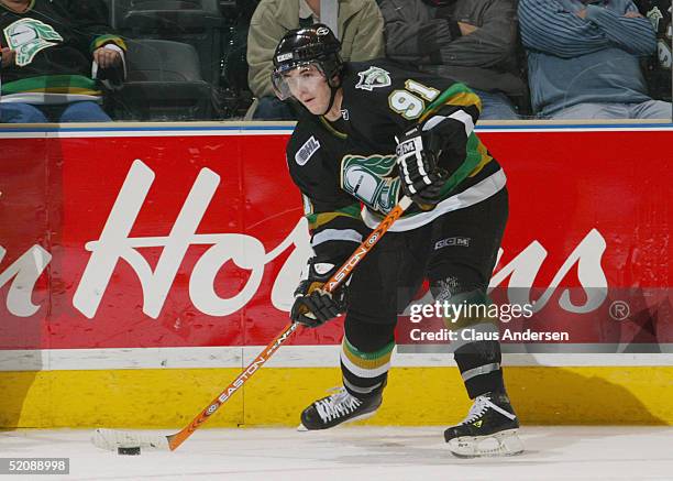 David Bolland of the London Knights looks to make a pass play from the wing during the Ontario Hockey League game against the Erie Otters at John...