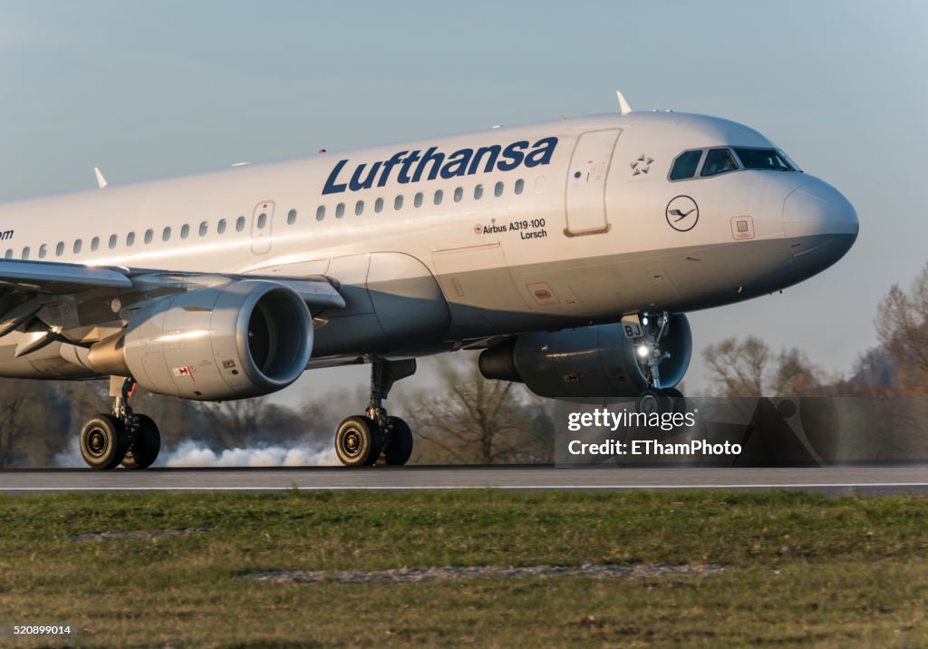 Landing Lufthansa passenger aircraft with smoking tires
