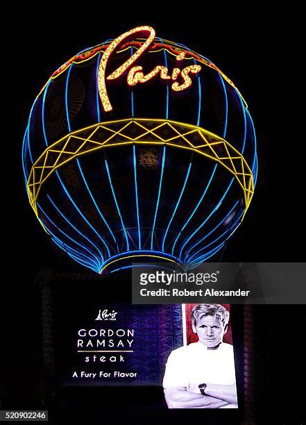 The entrance to the French-themed Paris Las Vegas Hotel and Casino in Las Vegas, Nevada, includes a neon-light embellished reproduction of the...