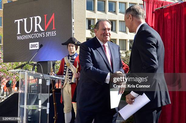 Former governors Mike Huckabee and Martin O'Malley speak during the "TURN: Washington Spies- DC Key Art Unveiling" at Kogan Plaza on The George...